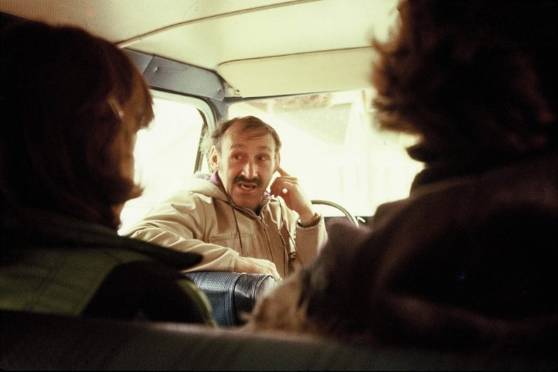 Professor Russwarin in the drivers seat of a van.