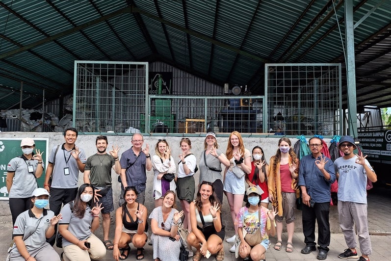 Group of students and professor. 