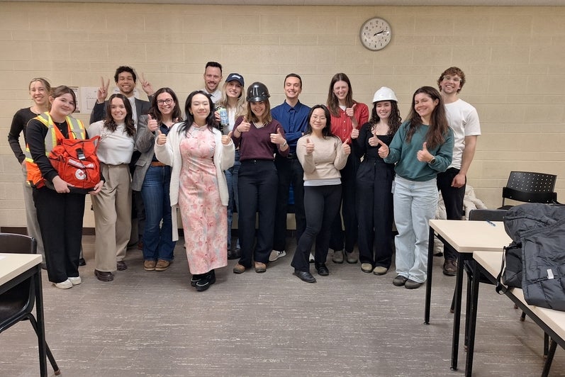 Group of students and professor. 