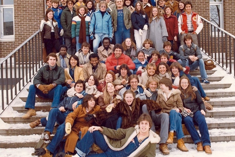 Group of 50-60 university students in 1979 on the stairs to a building