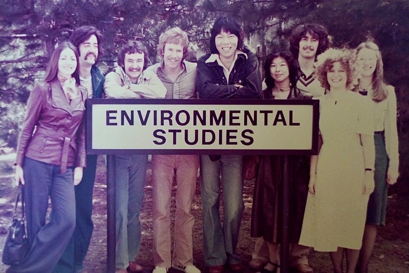 Classmates standing at the Environmental Studies sign.