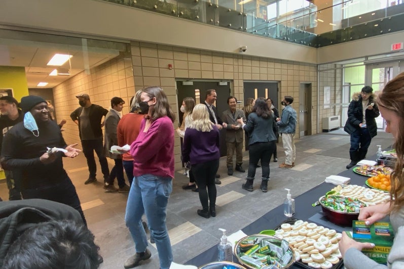 Faculty, students and staff socializing