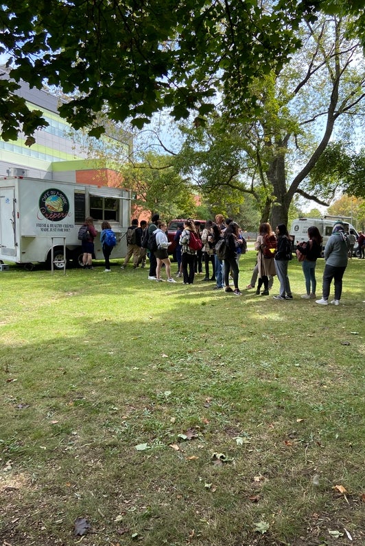 People lined up for food truck.