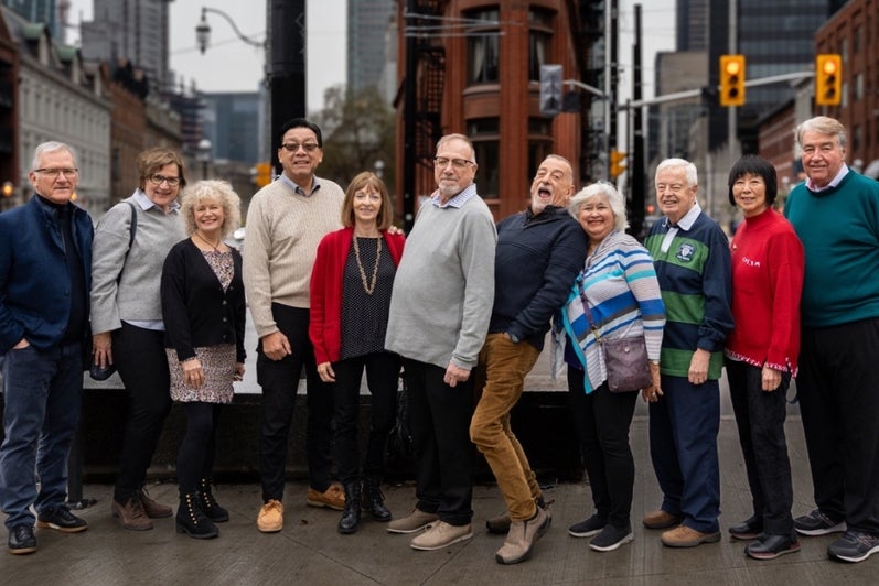 Waterloo Man-Environment class of 1976 group photo on Toronto street in 2023