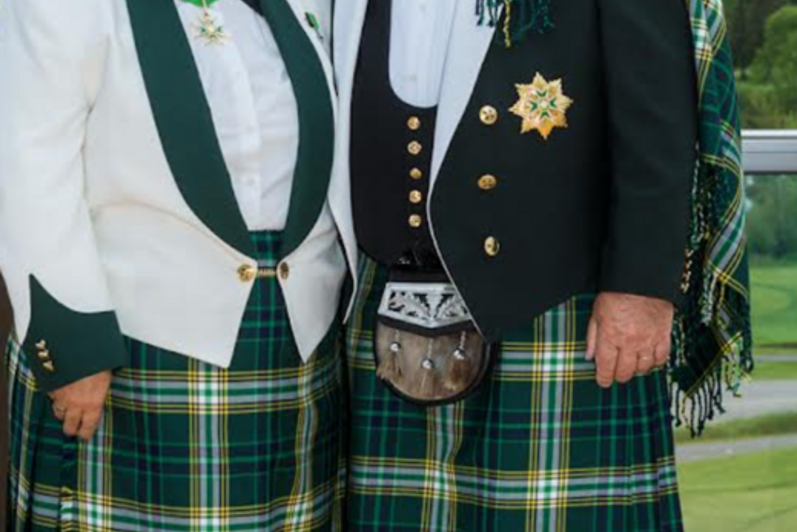 Man and woman in scottish kilts