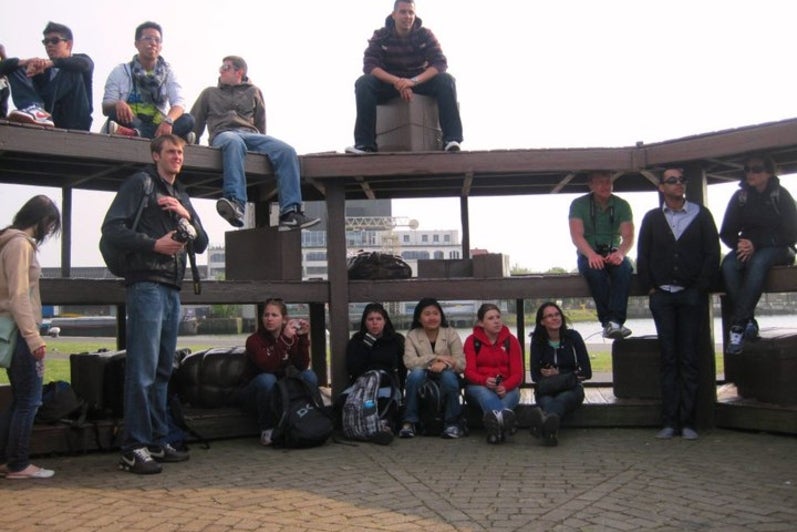 Students sitting on a tiered structure