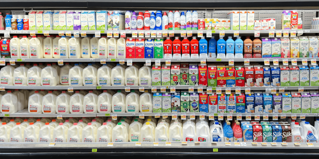 Milk products in the fridge at a store