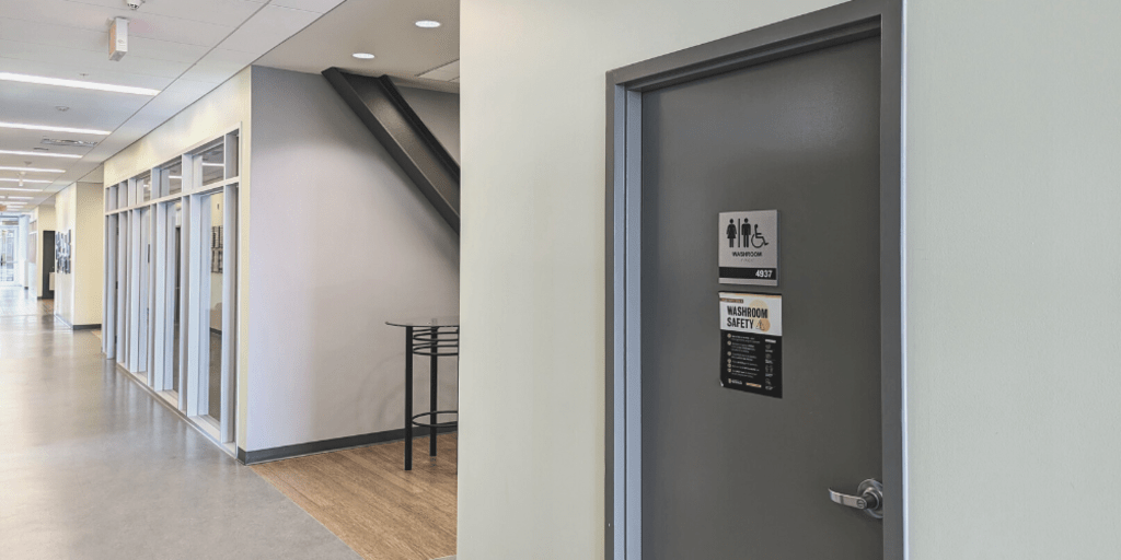 Door of all-gender washroom in EV3. 