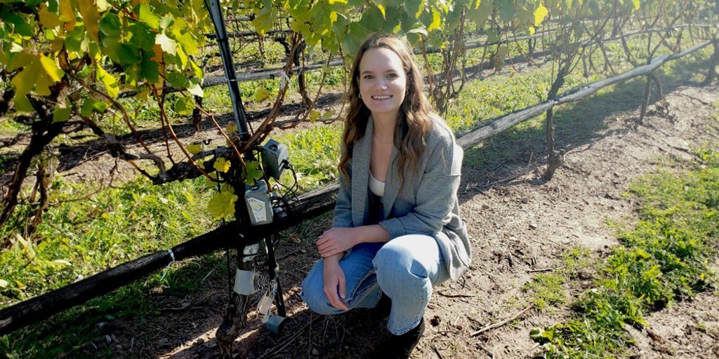Jessica Williamson in a vineyard