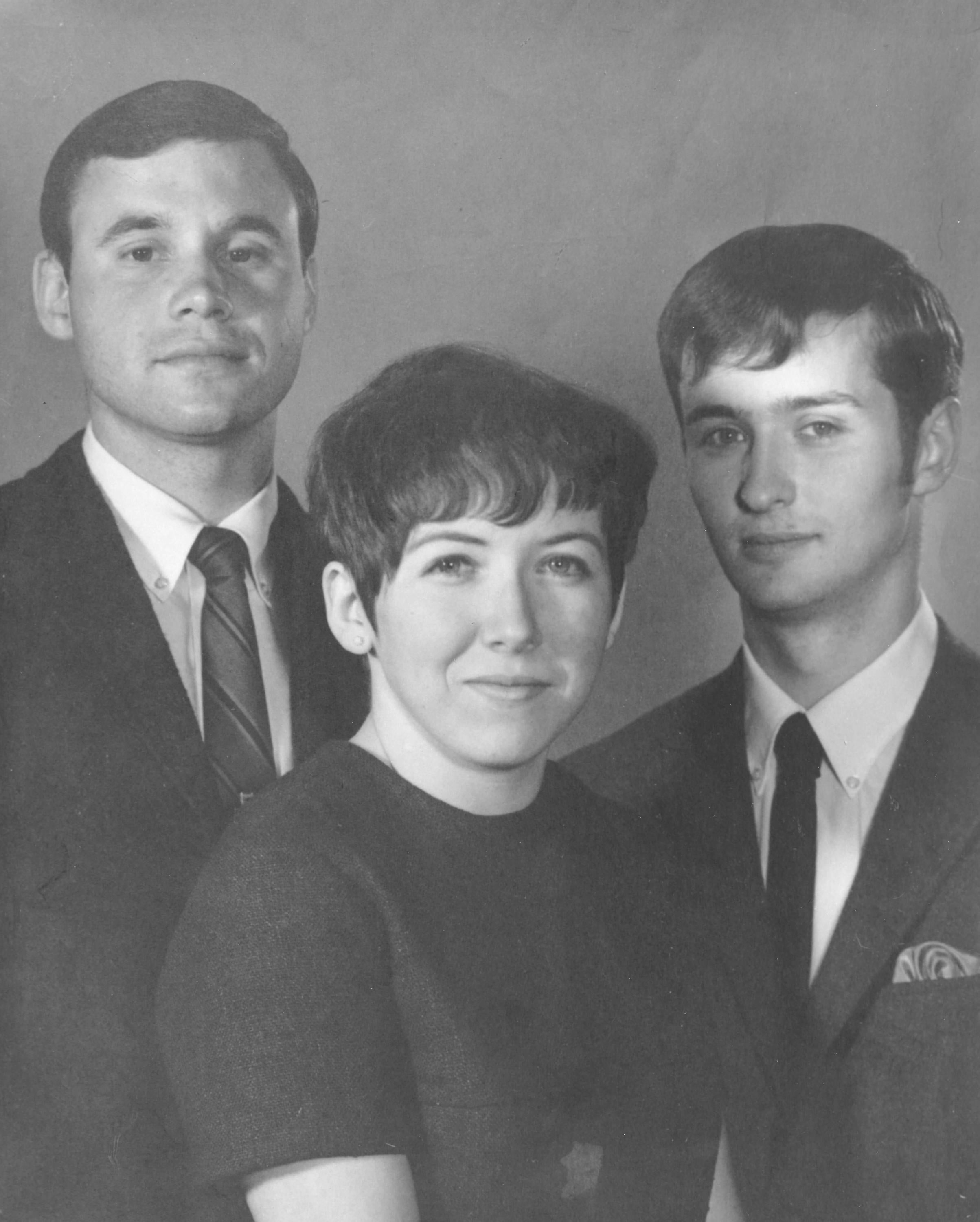 Black and white image of two young men and one women from 1968. 