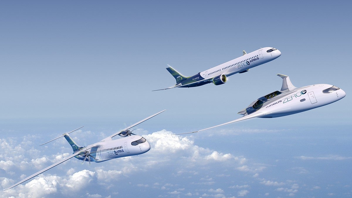 3 airbus branded airplanes in a clear blue sky