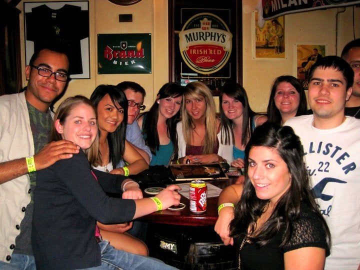 Group of university students raising drinks