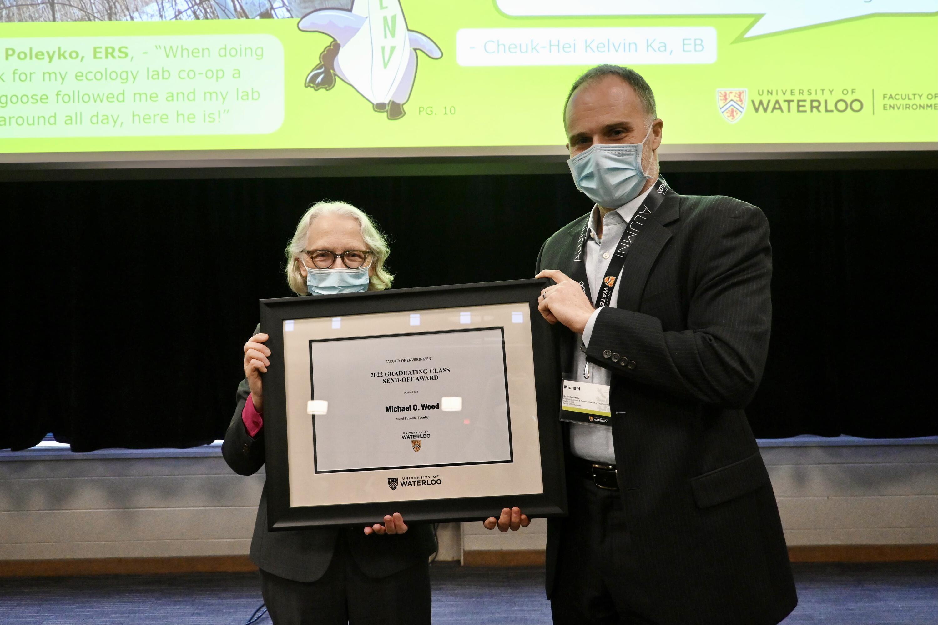 Dean Jean and Michael Wood holding the Favourite Faculty award