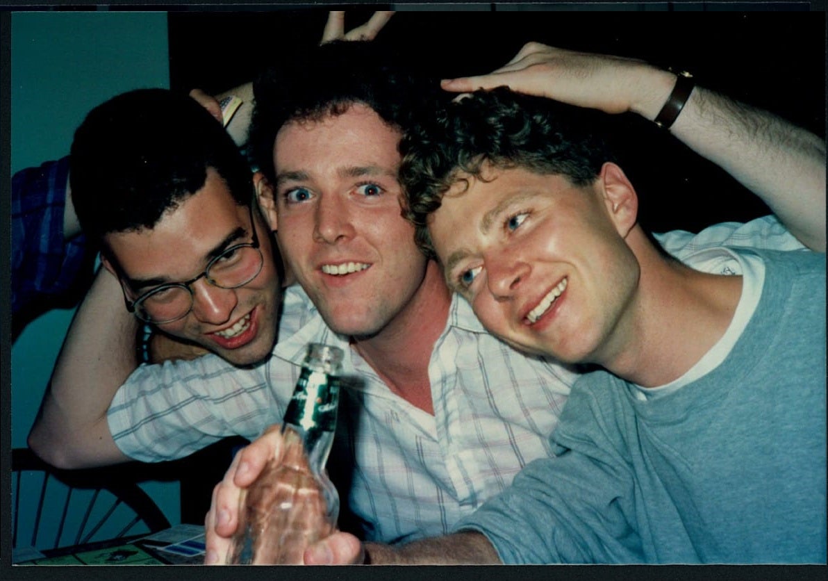Three planning alumni having fun at a party (~1990)