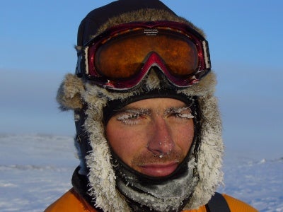 Man in arctic with frozen eyelashes