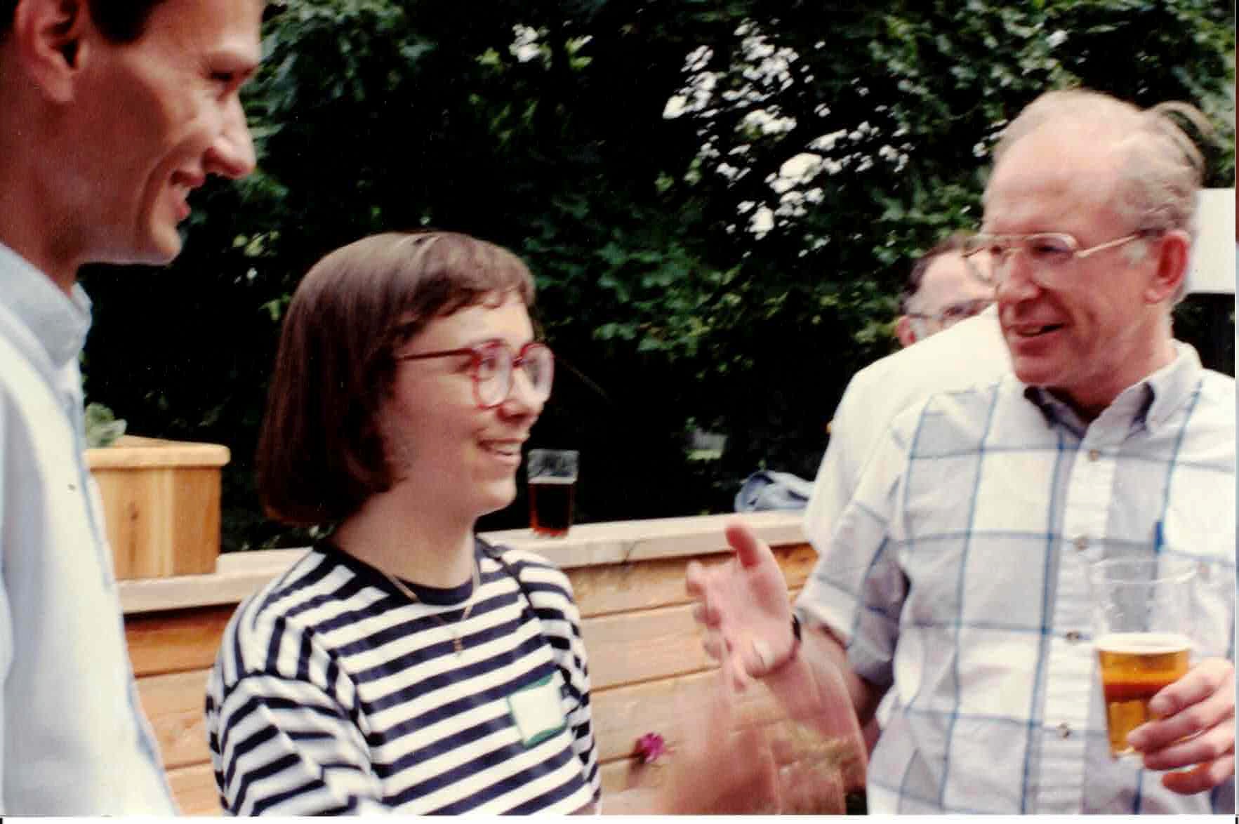People outdoors in conversation