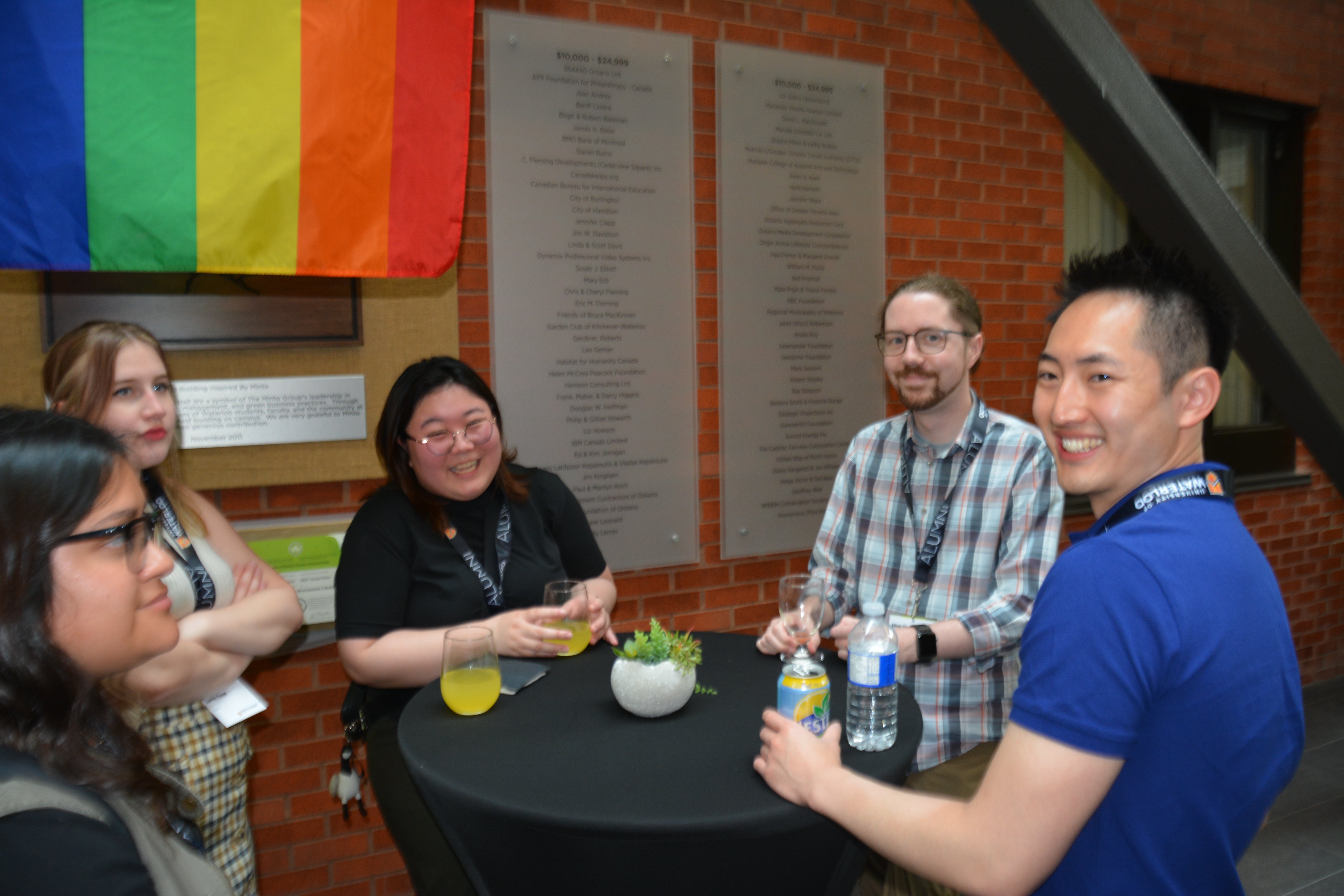 people around a table smiling