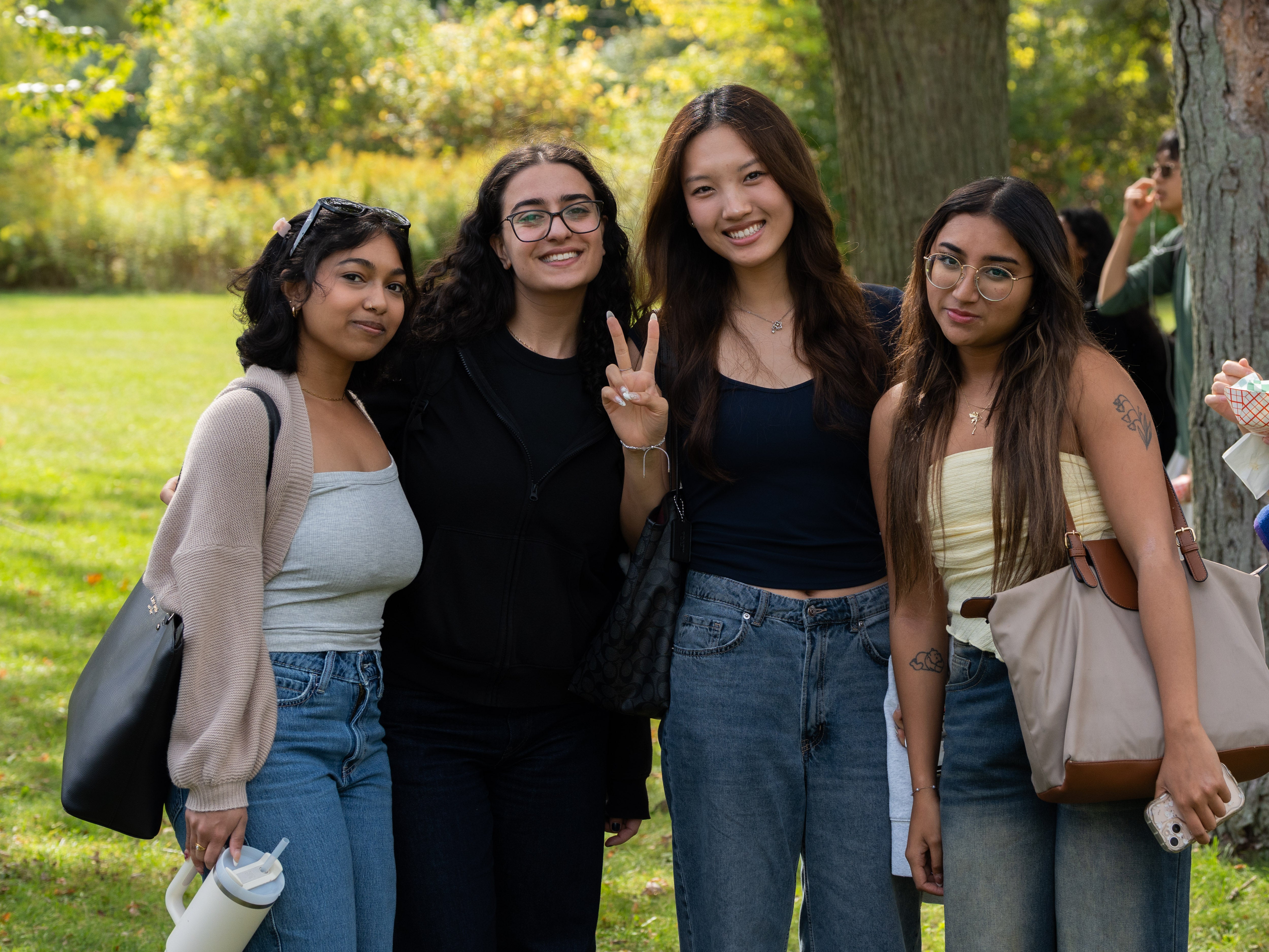Four people posing together.