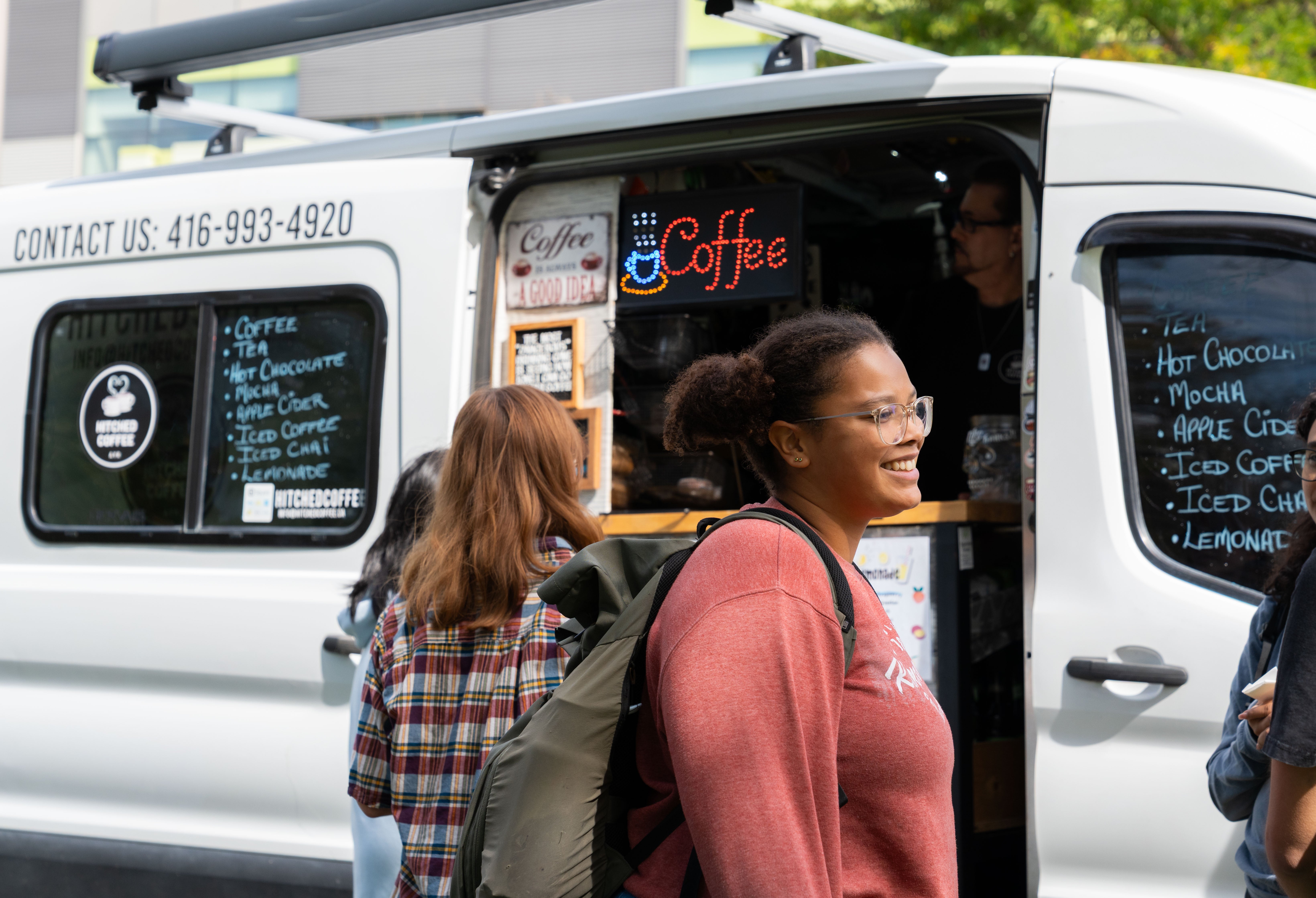 People being served their drinks at Hitched Coffee Truck