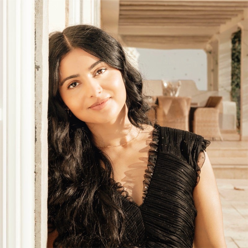 woman in black top smiling