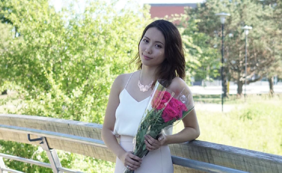 Jinny Tran holding flowers.