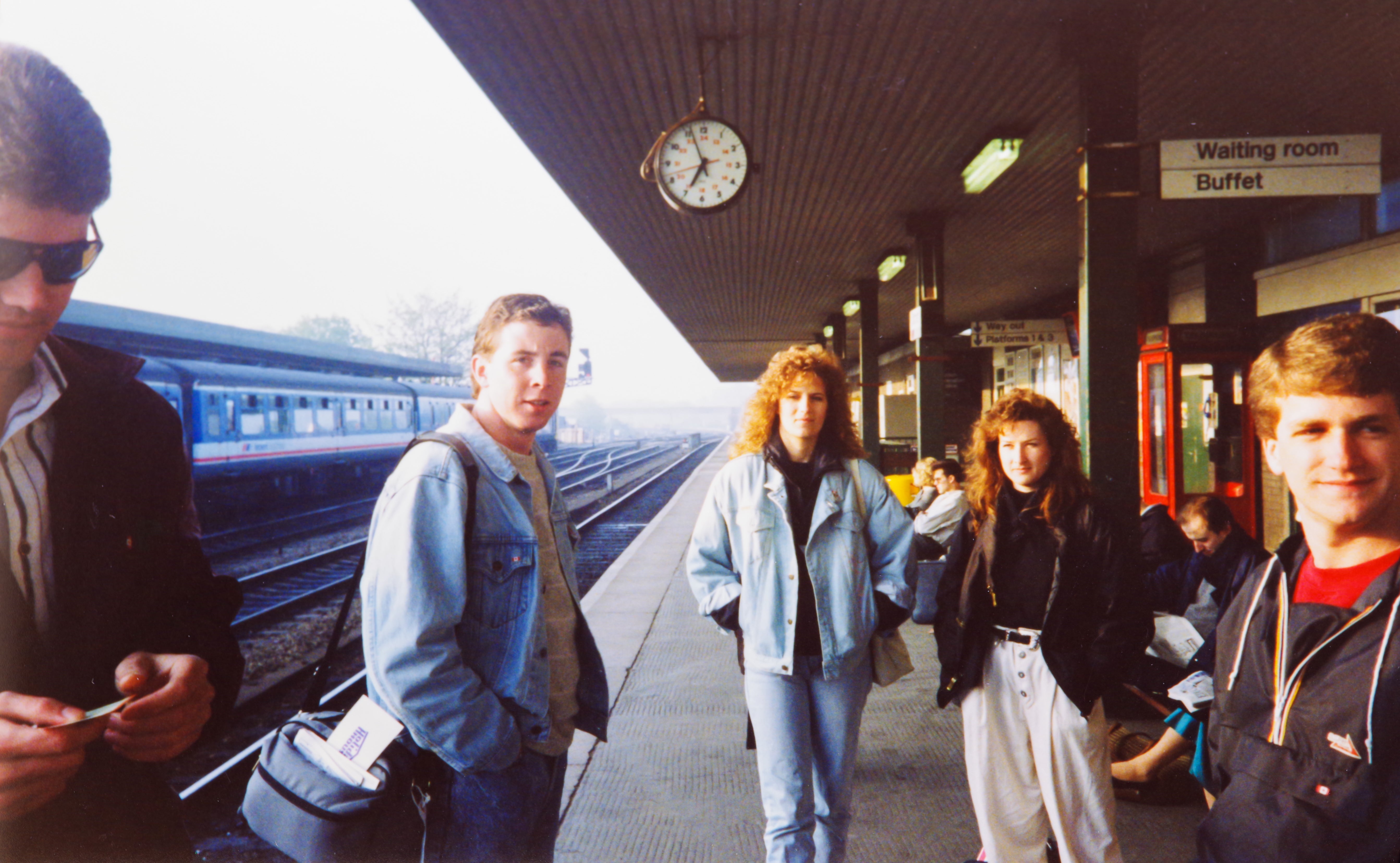 a group in atrain station posing 