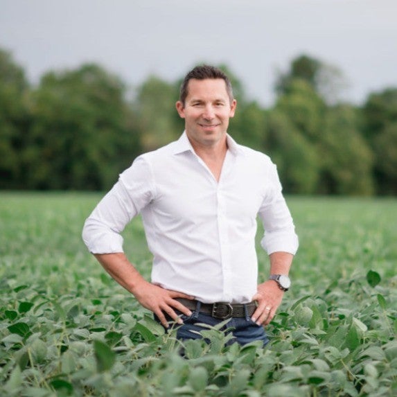 man in white shirt smilling