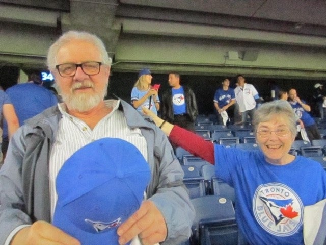 a couple attending a baseball game