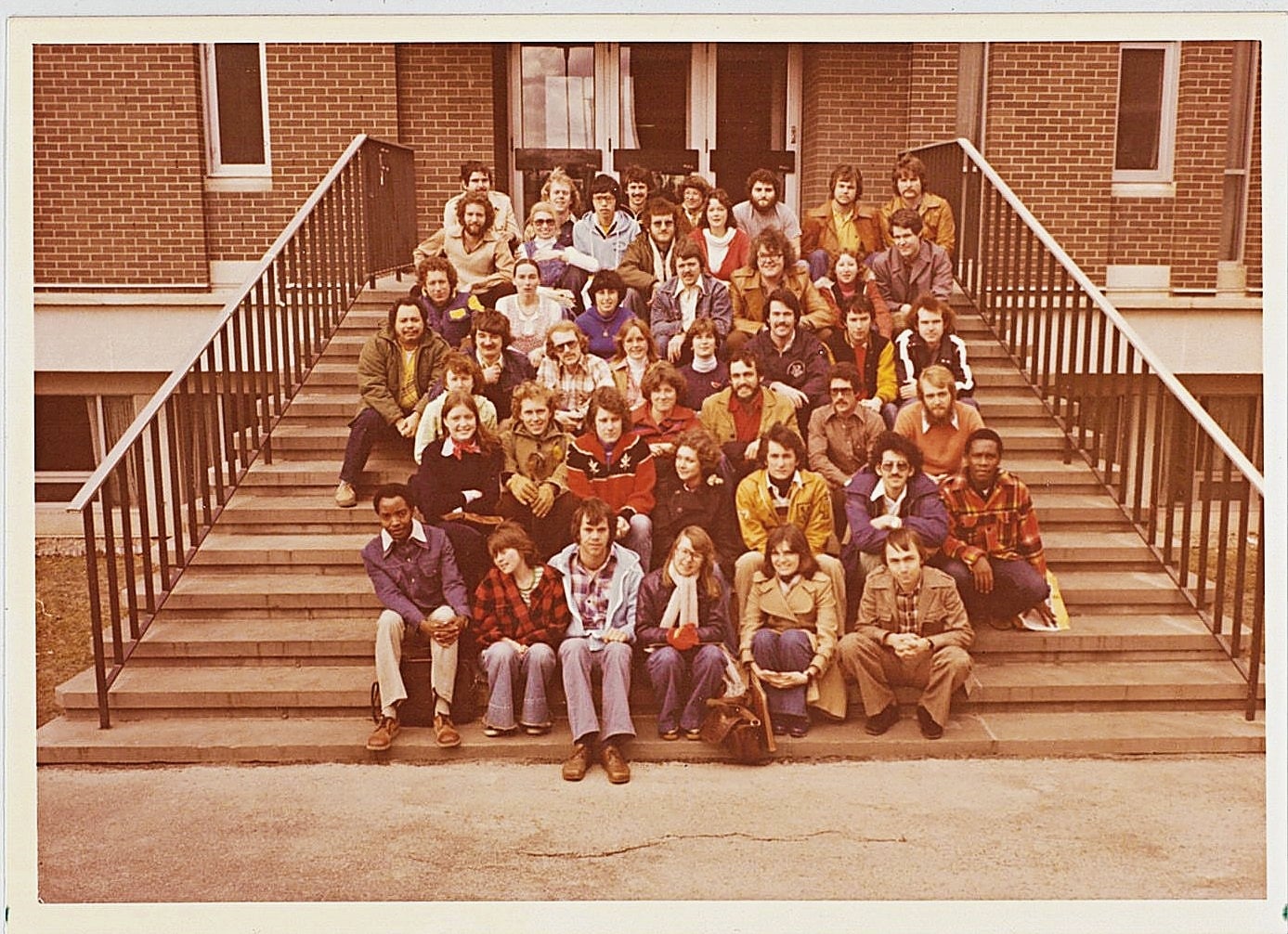 Planning class of 1977 on Environment 1 stairs