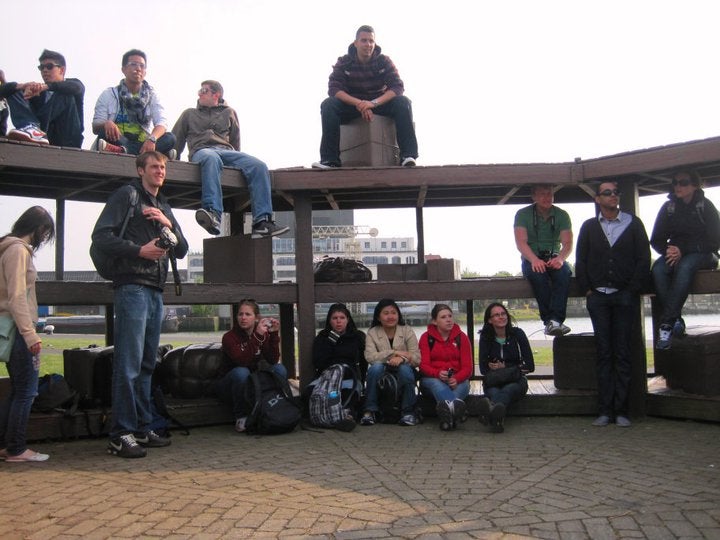 Students sitting on a tiered structure