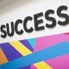 Success written on a colorful wall