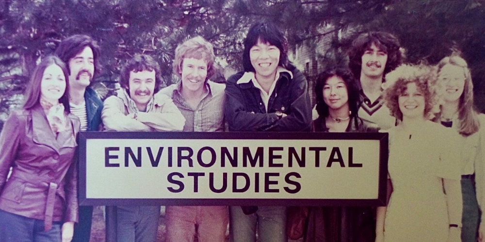 Students posed around the "Environmental Studies" sign