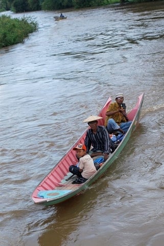 Locals driving a boat.