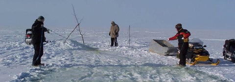 Researchers setting up a winter camp.