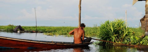 A fisherman setting up the net.