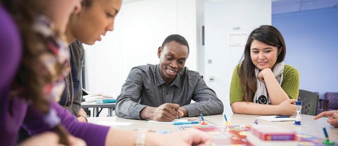 Students collaborating around a table