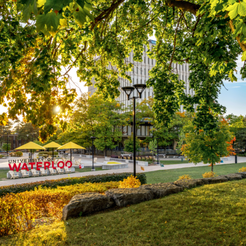 University of Waterloo campus sign in the fall sunlight.