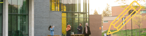 Students gathered in conversation with a yellow pencil icon.