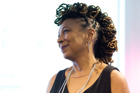 photo of a black woman smiling to the side.