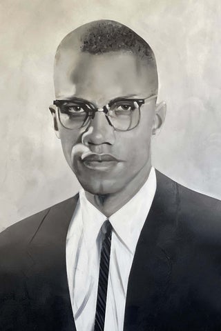 black and white headshot of Malcolm X