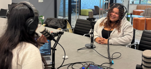 Two students recording a podcast 