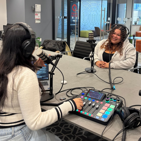 Two students recording a podcast 