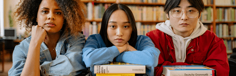 Three people in a library