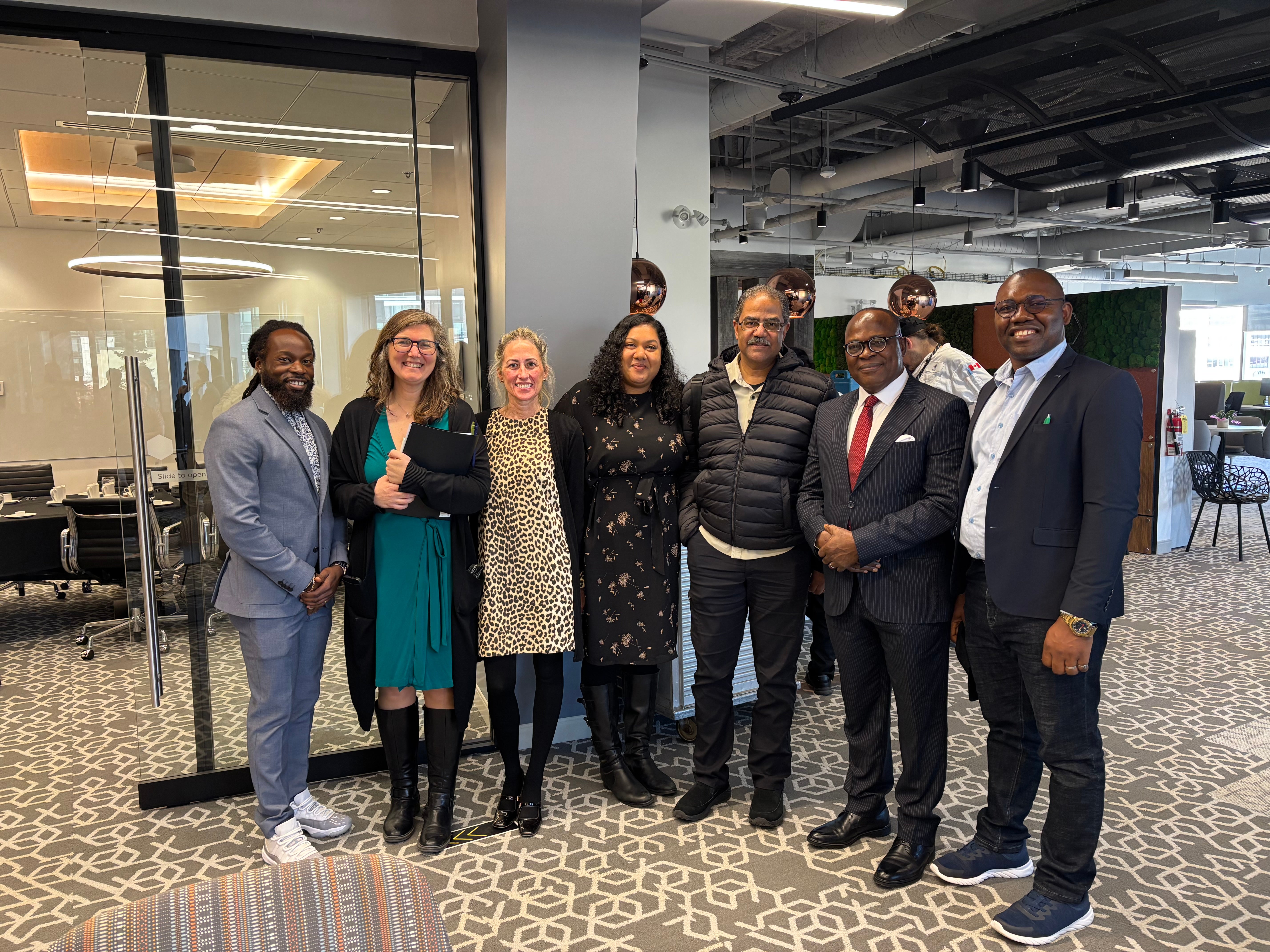Professor Simon Uchenna Ortuanya with staff In EDIR office space