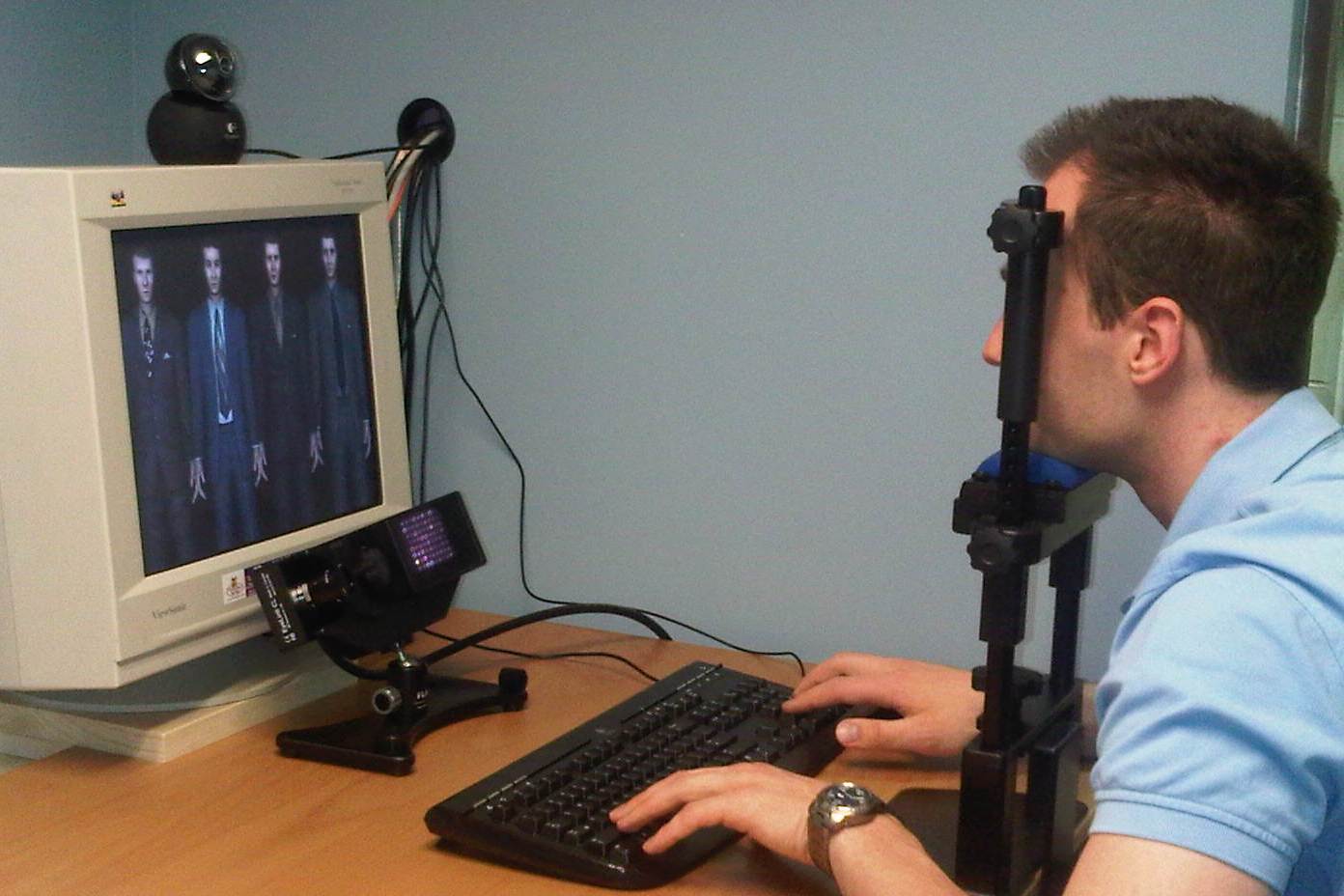 A man participating in eye tracking in a lab.