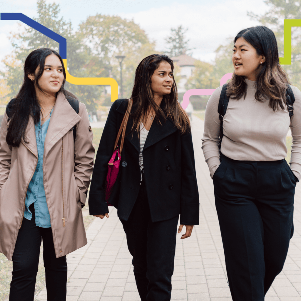 3 students talking and walking