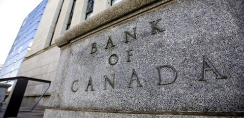 Close of the Bank of Canada sign, which is the words carved into a huge stone block as part of the building