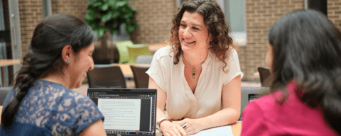 Person sitting and talking to their supervisor