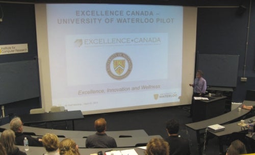 Mark Haslett announces the Excellence Canada pilot at an all-staff meeting on April 22