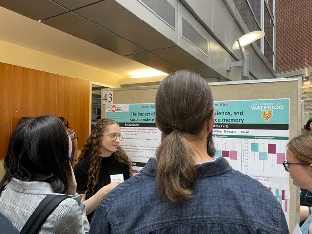 Amie Durston presenting her poster titled "The impact of contextual self-relevance, valence, and social anxiety on face recognition and source memory"